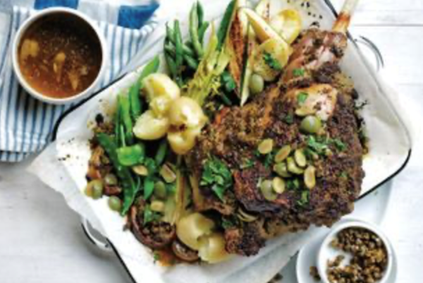 Roasted lamb leg with lemon, olives and spring vegetables