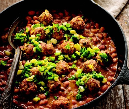 Roasted lamb meatballs with tomato-bean ragout and green garlic
