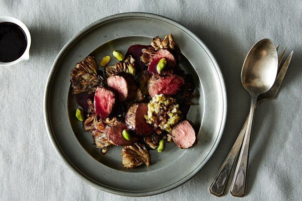 Roasted lamb medallions with maitake mushrooms, pistachios, and blackberry