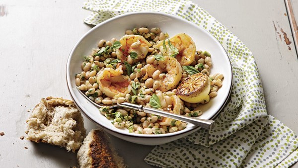 Roasted lemons with white beans, olives, herbs, and shrimp