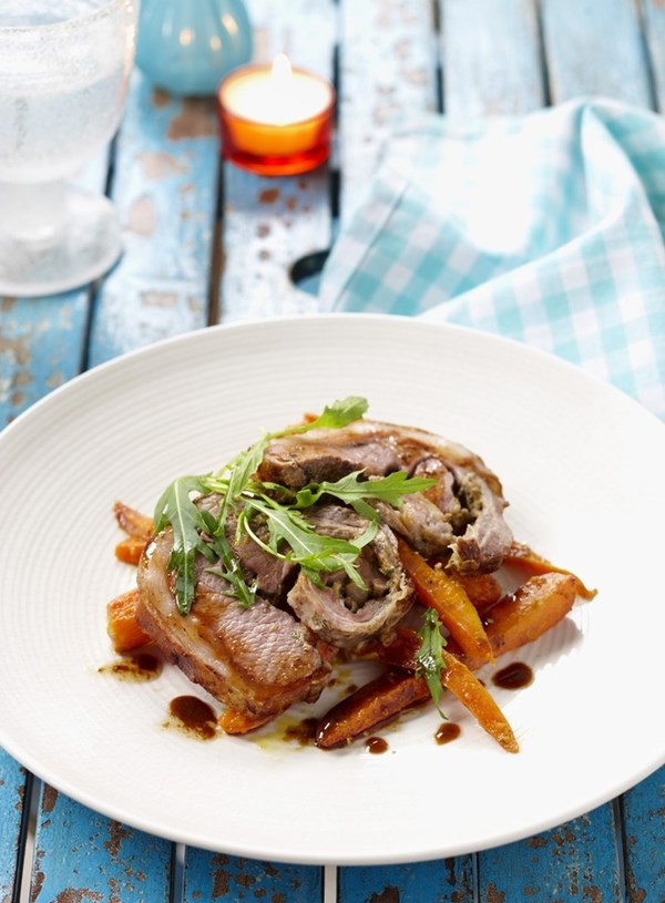 Roasted loin of lamb with orange and cumin glazed carrots
