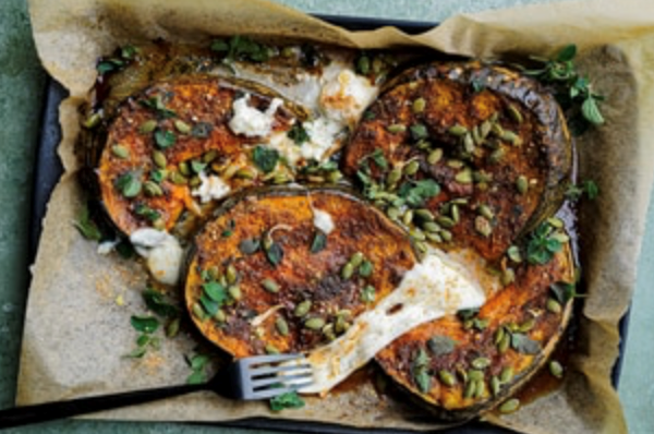 Roasted maple-glazed pumpkin with chicken salt, burrata and pepitas