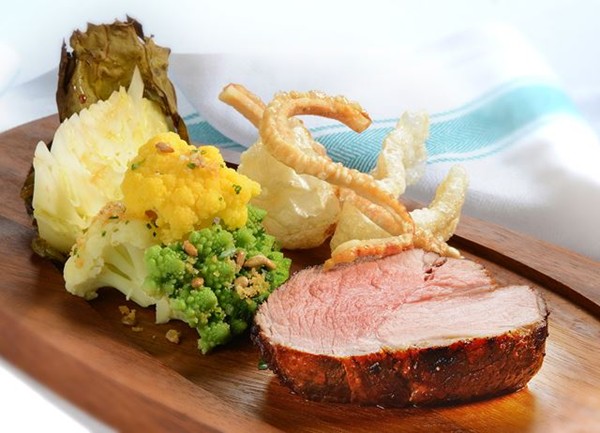 Roasted organic pork with salt and pepper crackling and autumn brassicas