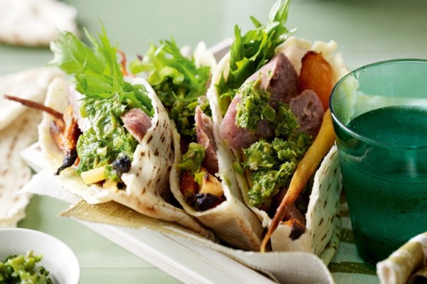 Roasted parsnip & carrot pita pockets with sausage and green olive salsa