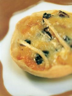 Roasted pepper, olive and Brie tartlets with a balsamic vinaigrette