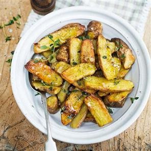 Roasted pink fir apple potatoes with slow-cooked garlic