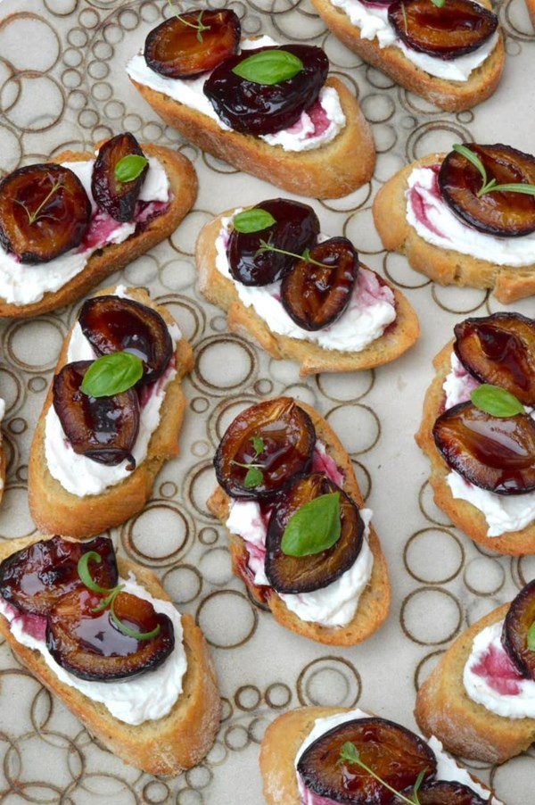 Roasted plum bruschetta with whipped ricotta