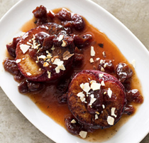 Roasted plums with dried cherries and almonds