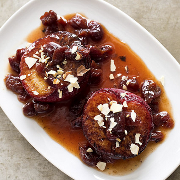 Roasted plums with dried cherries and almonds