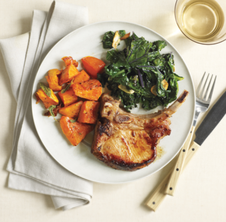 Roasted pork chops and butternut squash with kale