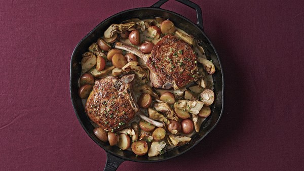 Roasted pork chops with baby artichokes and new potatoes