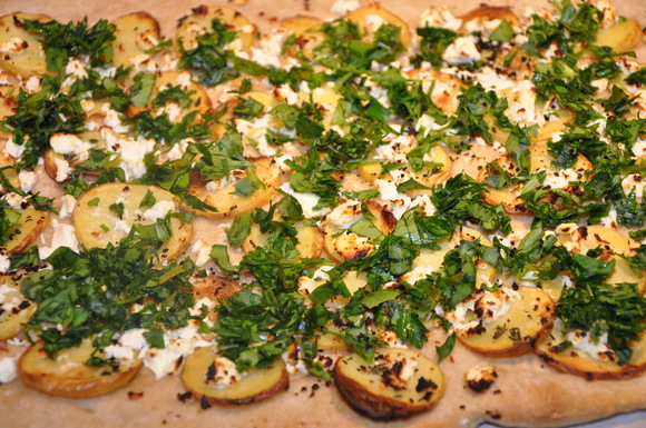 Roasted potato pizza with goat cheese, spring herbs and Urfa biber