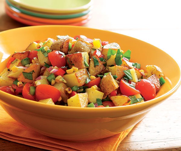 Roasted potato salad with bell peppers, roasted corn & tomatoes