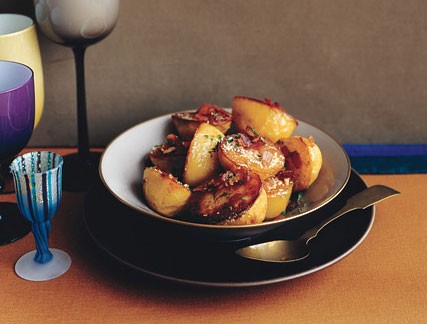 Roasted potatoes with bacon, cheese, and parsley