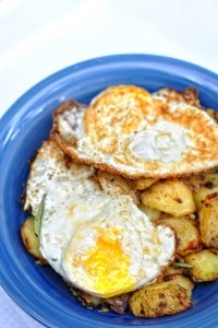 Roasted potatoes with eggs over easy