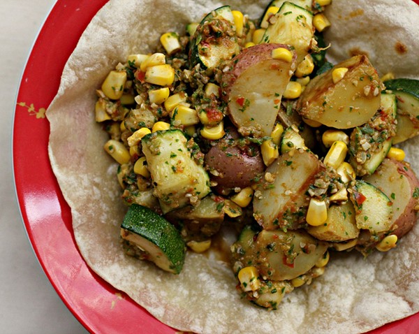 Roasted potatoes, zucchini and corn tostadas with romesco sauce