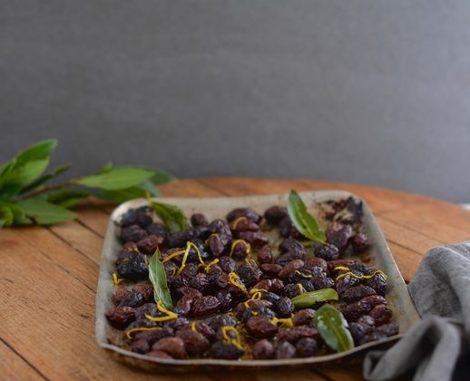 Roasted preserved Kalamata olives with lemon and bay leaves