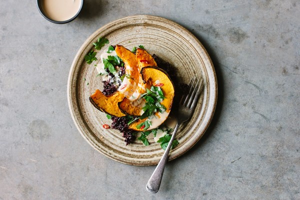 Roasted pumpkin with black rice and tangerine tahini sauce