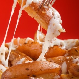 Roasted red potatoes with melted cheese
