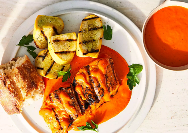 Roasted red sauce with grilled halibut and summer squash