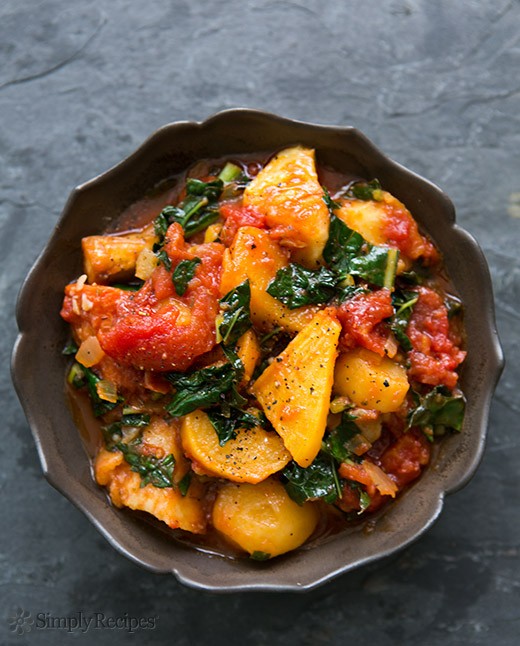 Roasted root vegetables with tomatoes and kale