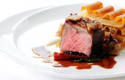 Roasted sirloin of beef with a bone marrow sauce, salsify, mushrooms and red wine shallots