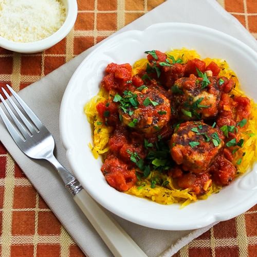 Roasted spaghetti squash with homemade tomato-garlic sauce and chicken sausage meatballs