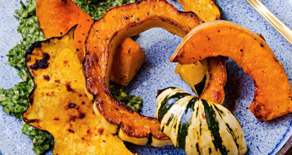 Roasted squash wedges with collard-peanut pesto