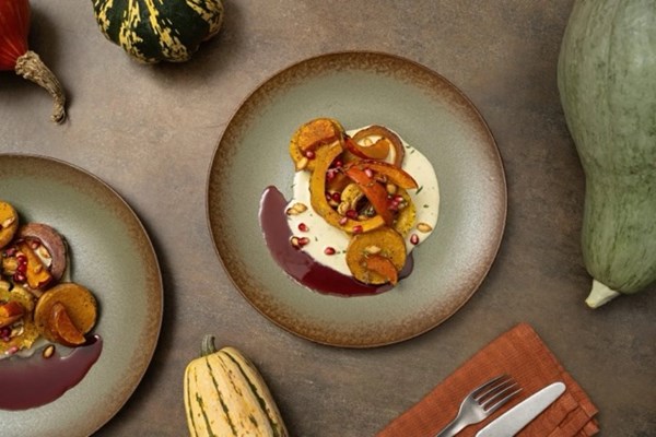 Roasted squash with savory sabayon, squash seeds, and pomegranate 