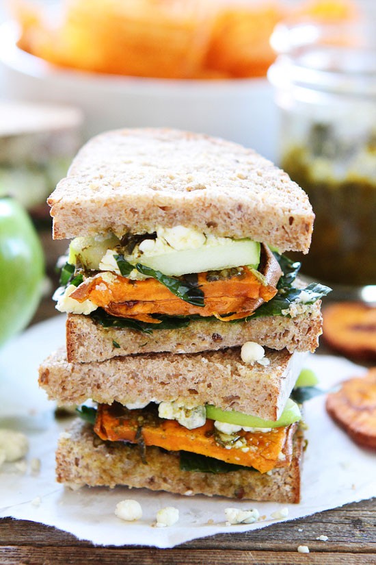 Roasted sweet potato sandwich with apples, pesto, kale, and blue cheese