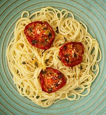 Roasted tomatoes studded with garlic