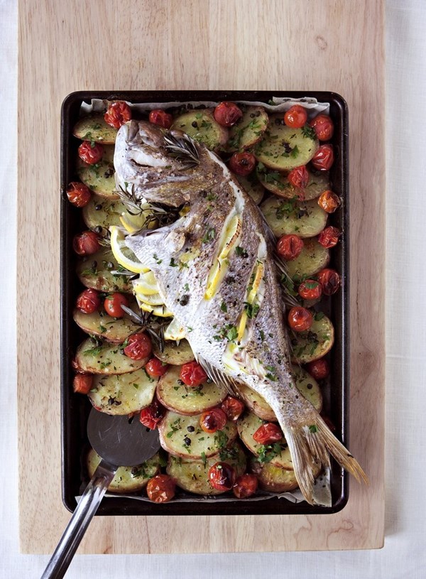 Roasted whole fish on rosemary potatoes