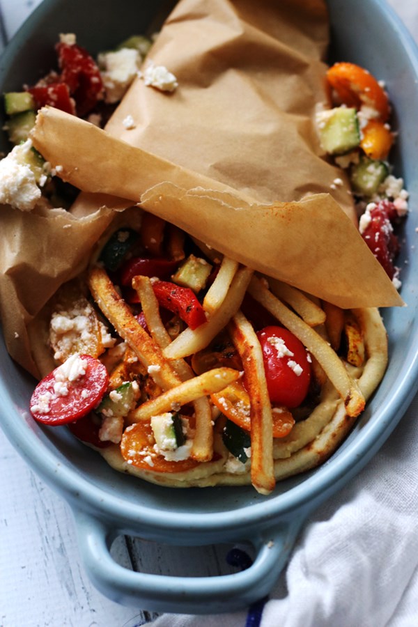 Roasted zucchini and bell pepper vegetarian gyros with hummus and cucumber-feta salsa