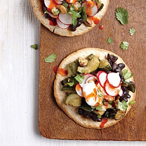 Roasted zucchini and black bean tostadas with crisp radish relish