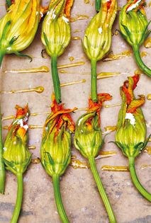 Roasted zucchini flowers with ricotta, mint, and lemon peel
