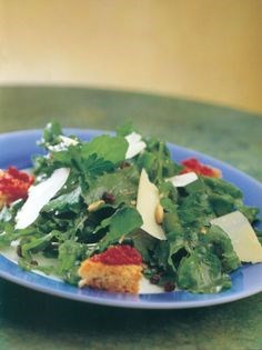 Rocket and flat-leaf parsley salad with currants, Parmesan, a balsamic dressing and tomato crostini