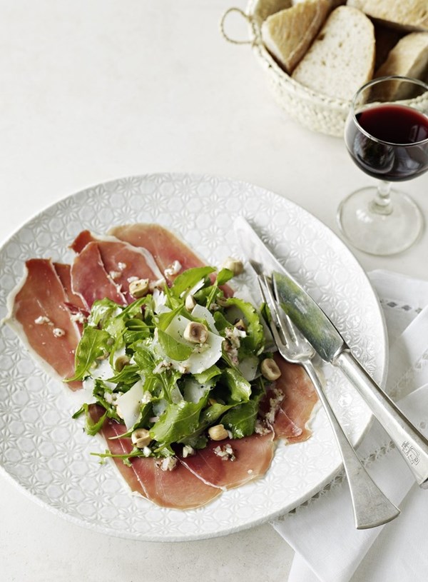Rocket salad with serrano ham, Manchego cheese and hazelnuts
