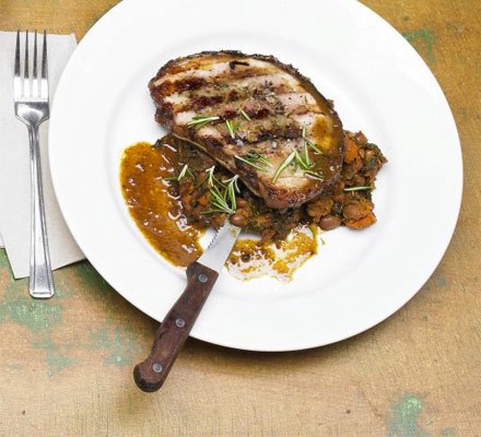 Rolled and stuffed pork belly with Tuscan-style bean and tomato stew