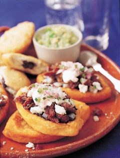 Rolled filled tortillas in peanut sauce (Encacahuatadas)