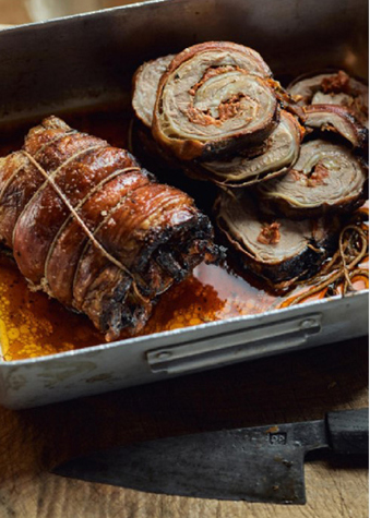 Rolled lamb breast with herbs, lemon and tomatoes