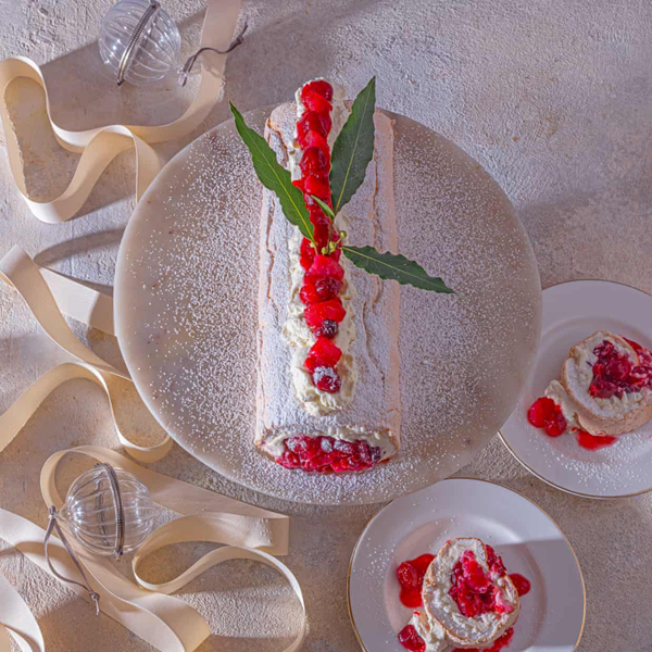 Rolled Pavlova with pear, cranberry and ginger