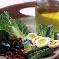 Romaine, avocado and crisp shallot salad with quail's eggs