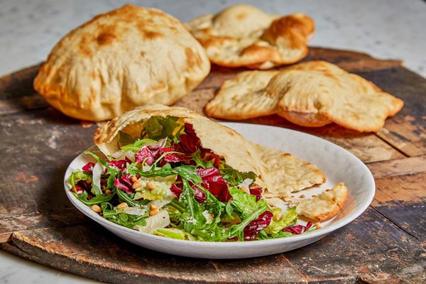 Roman cloud bread with mixed greens and fennel salad