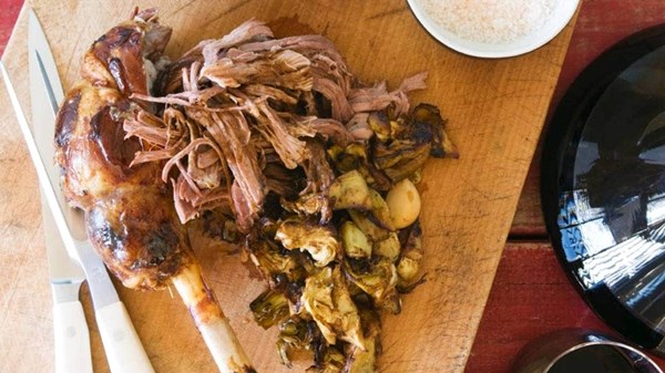Roman-style leg of lamb and slow-cooked flat green beans in tomato sauce