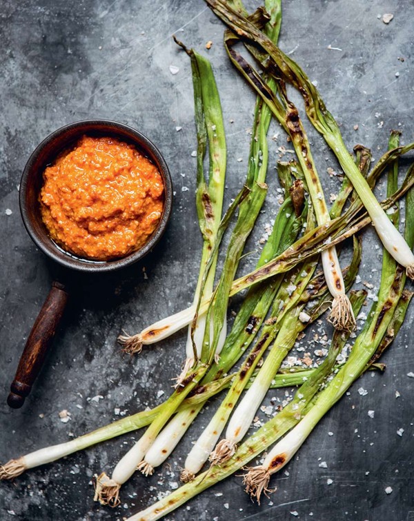 Romesco sauce with grilled spring onions