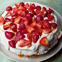 Rose and pepper Pavlova with passionfruit and strawberries