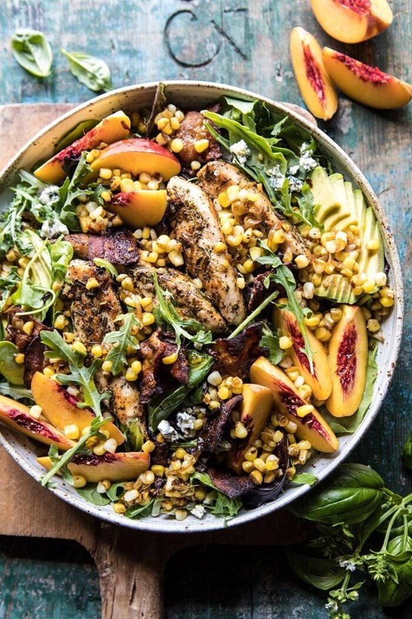 Rosemary chicken, caramelized corn, and peach salad with hot bacon vinaigrette