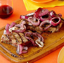 Rosemary-rubbed rib-eye with charred red onions