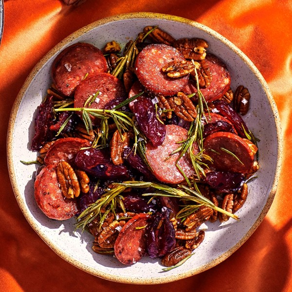 Rosemary-sizzled salami, dates, and pecans