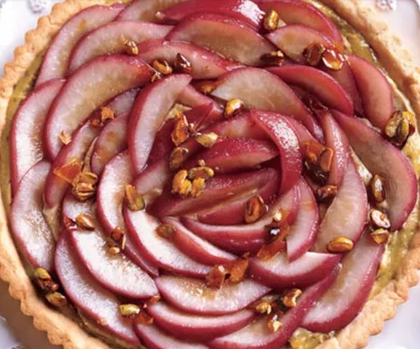 Rosy poached pear and pistachio tart